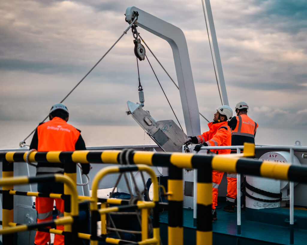 Crew on board a ship deploying a Continuous Plankton Recorder device